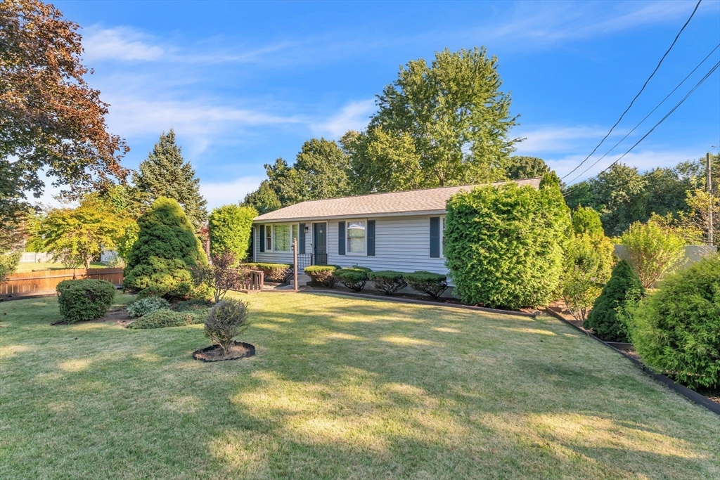 front view of a house with a yard