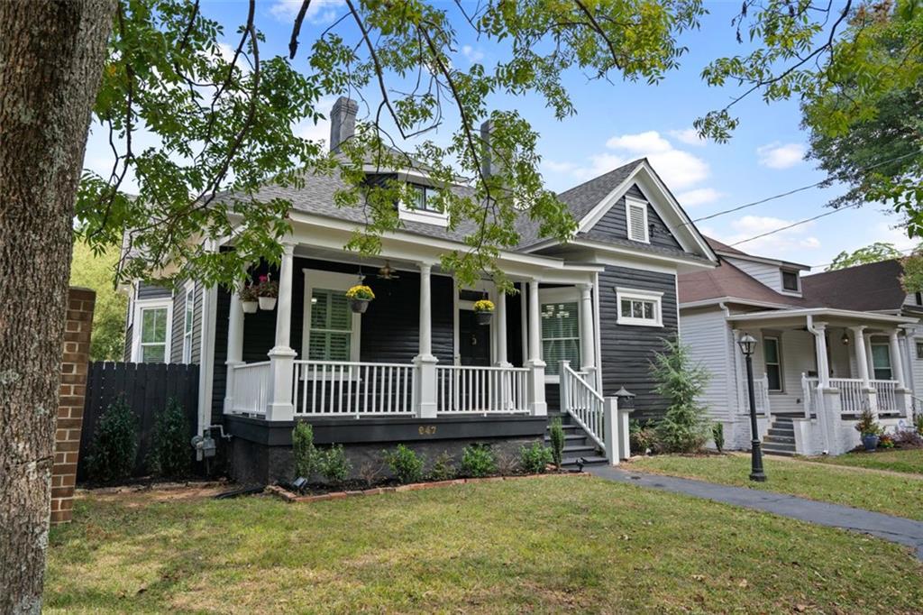 a front view of a house with a garden