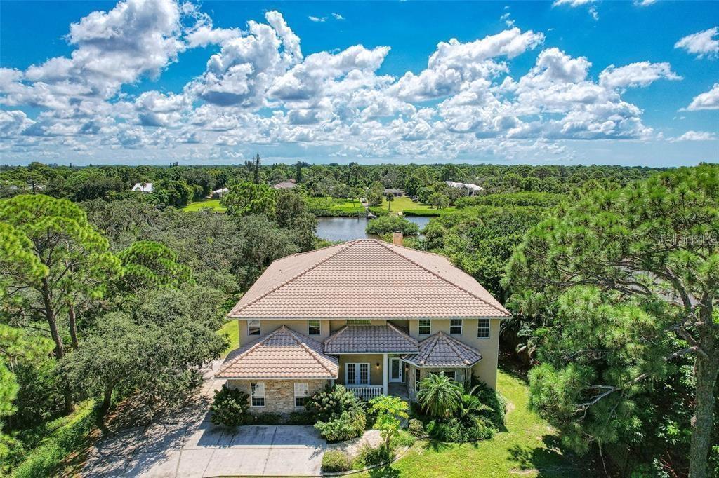 a aerial view of a house with a yard and plants