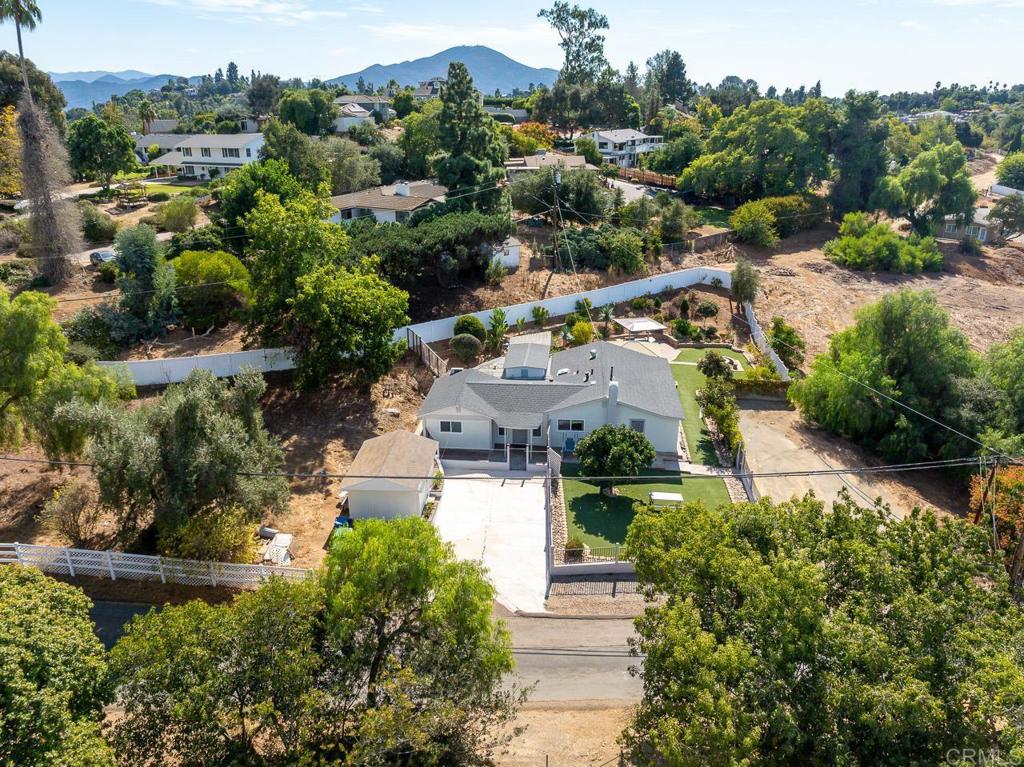 an aerial view of a house with a garden