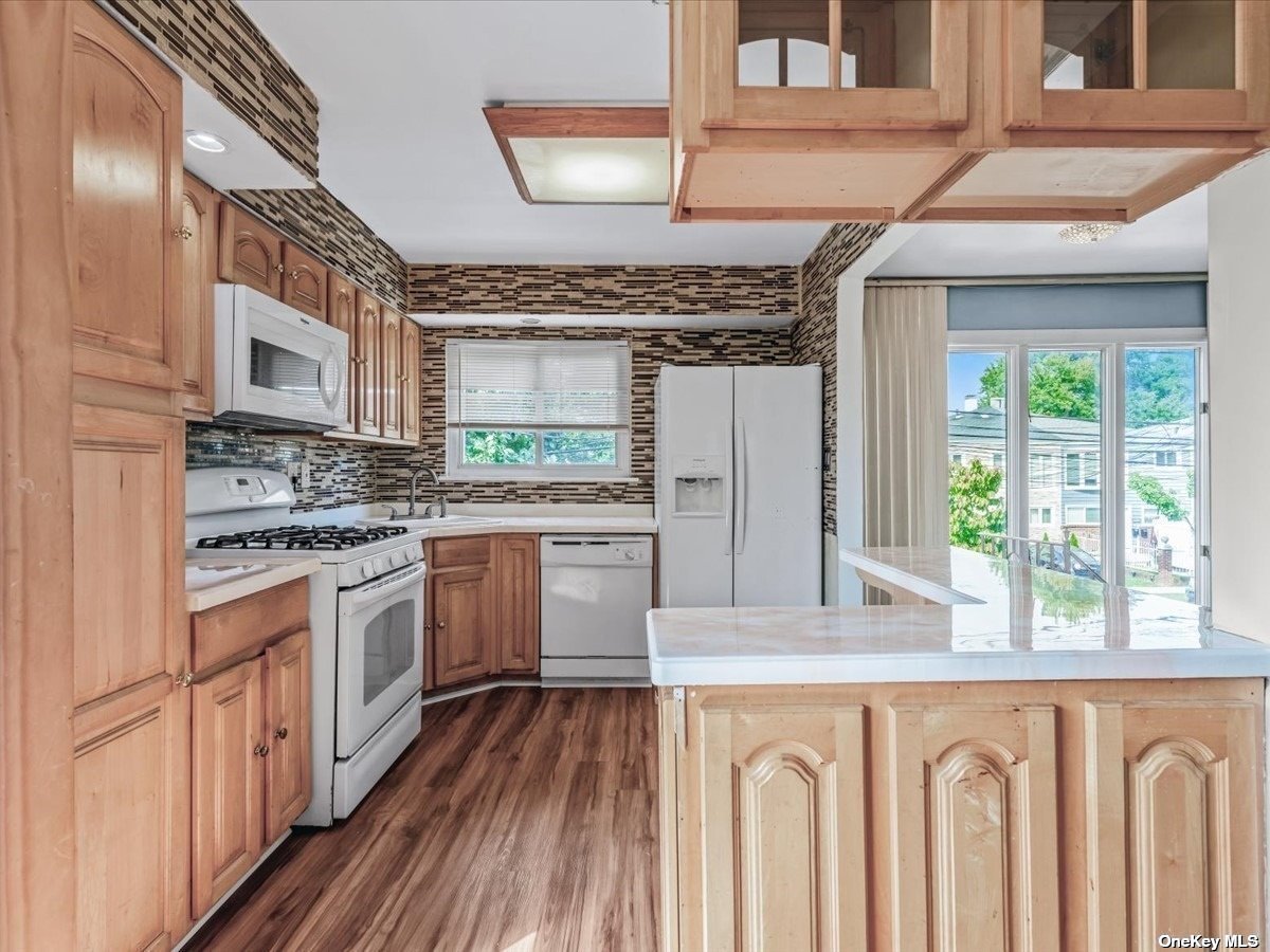 a kitchen with a stove a sink and a refrigerator