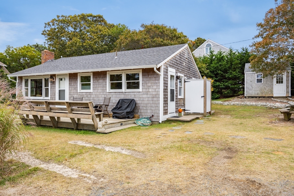 a view of a house with swimming pool and sitting area