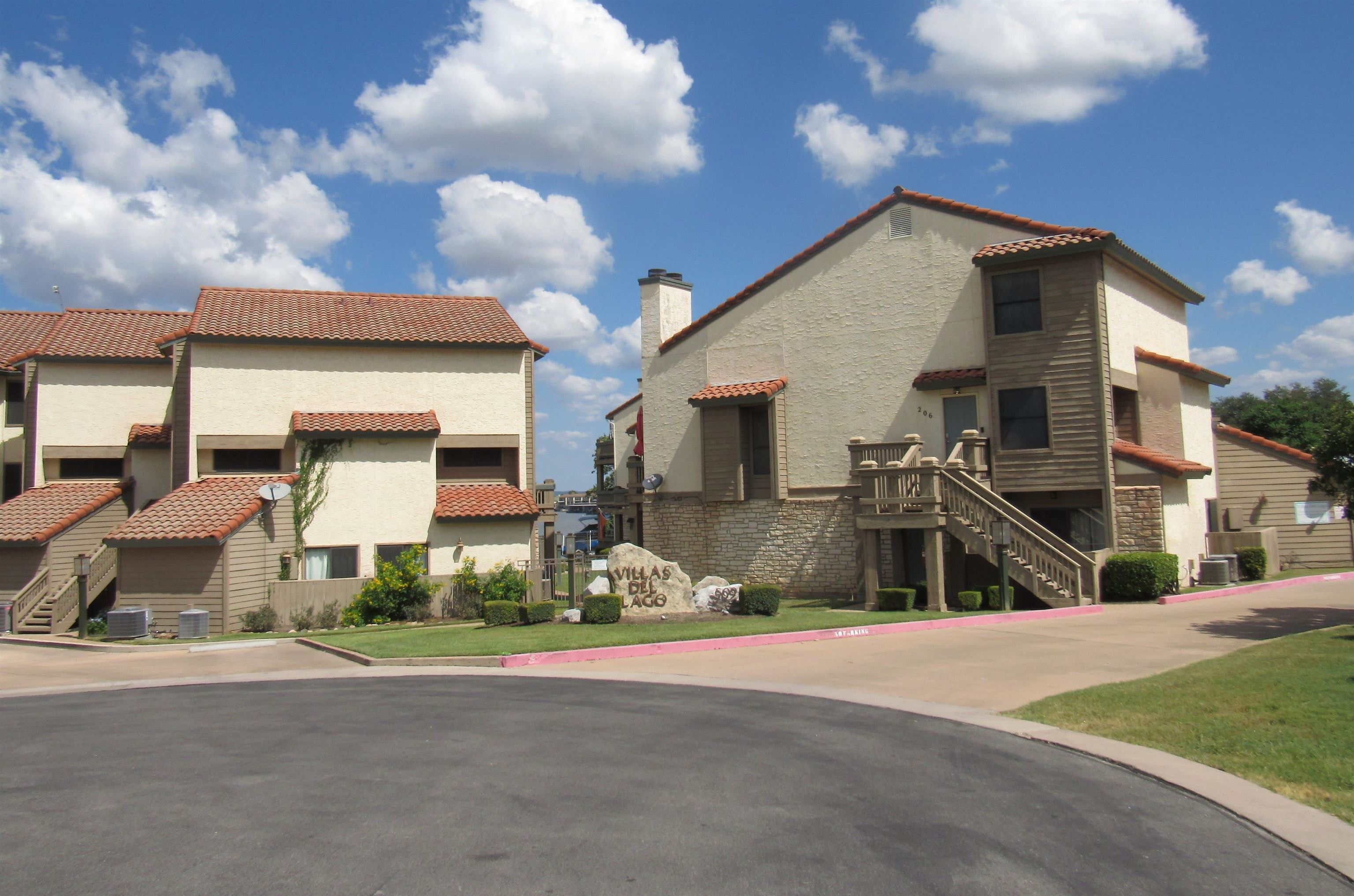 a view of a street in front of a house