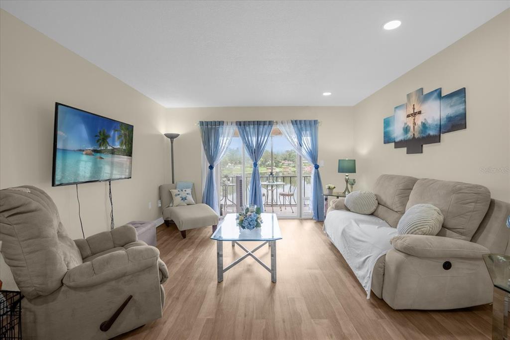 a living room with furniture and a large window