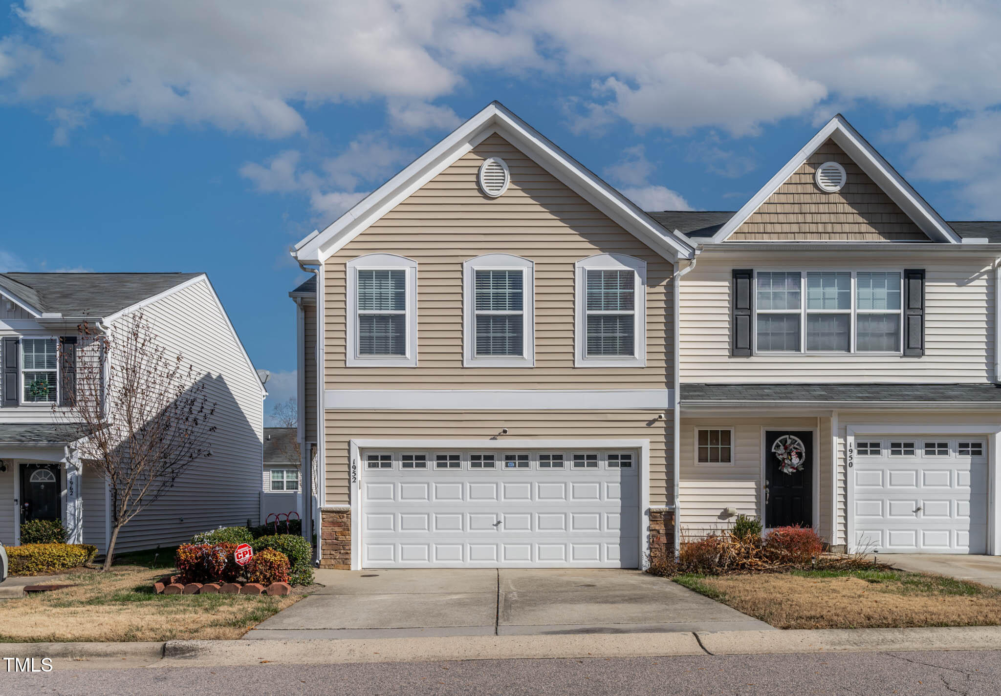 a front view of a house with a garage