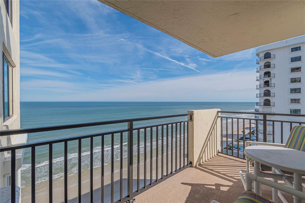 a balcony with wooden floor