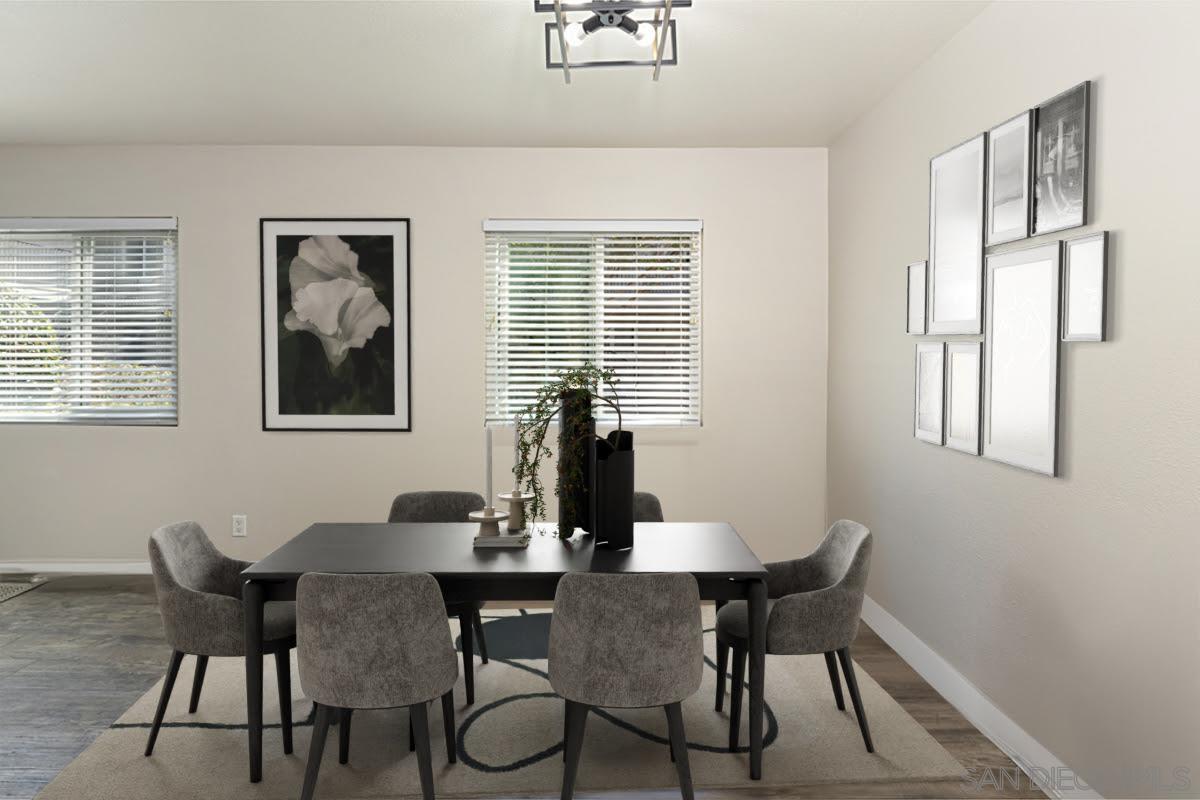 a view of a dining room with furniture and window