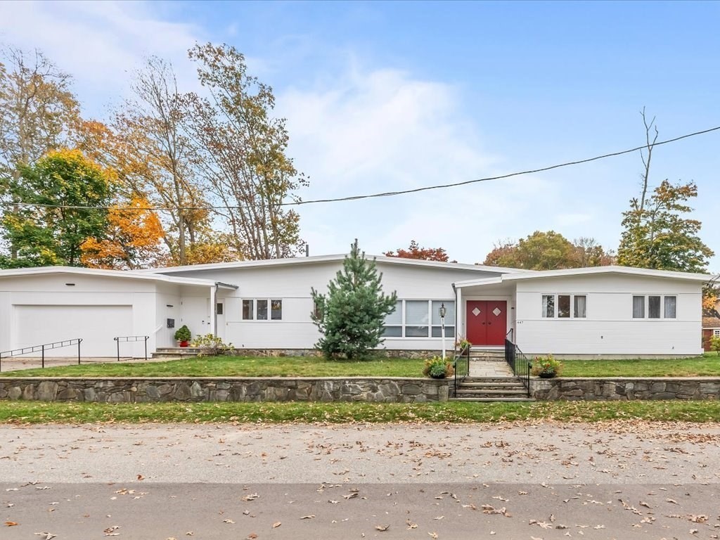 a front view of a house with a yard