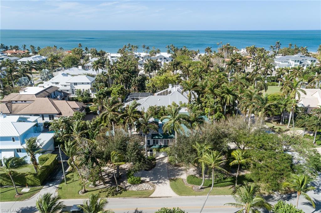 an aerial view of a houses with a yard