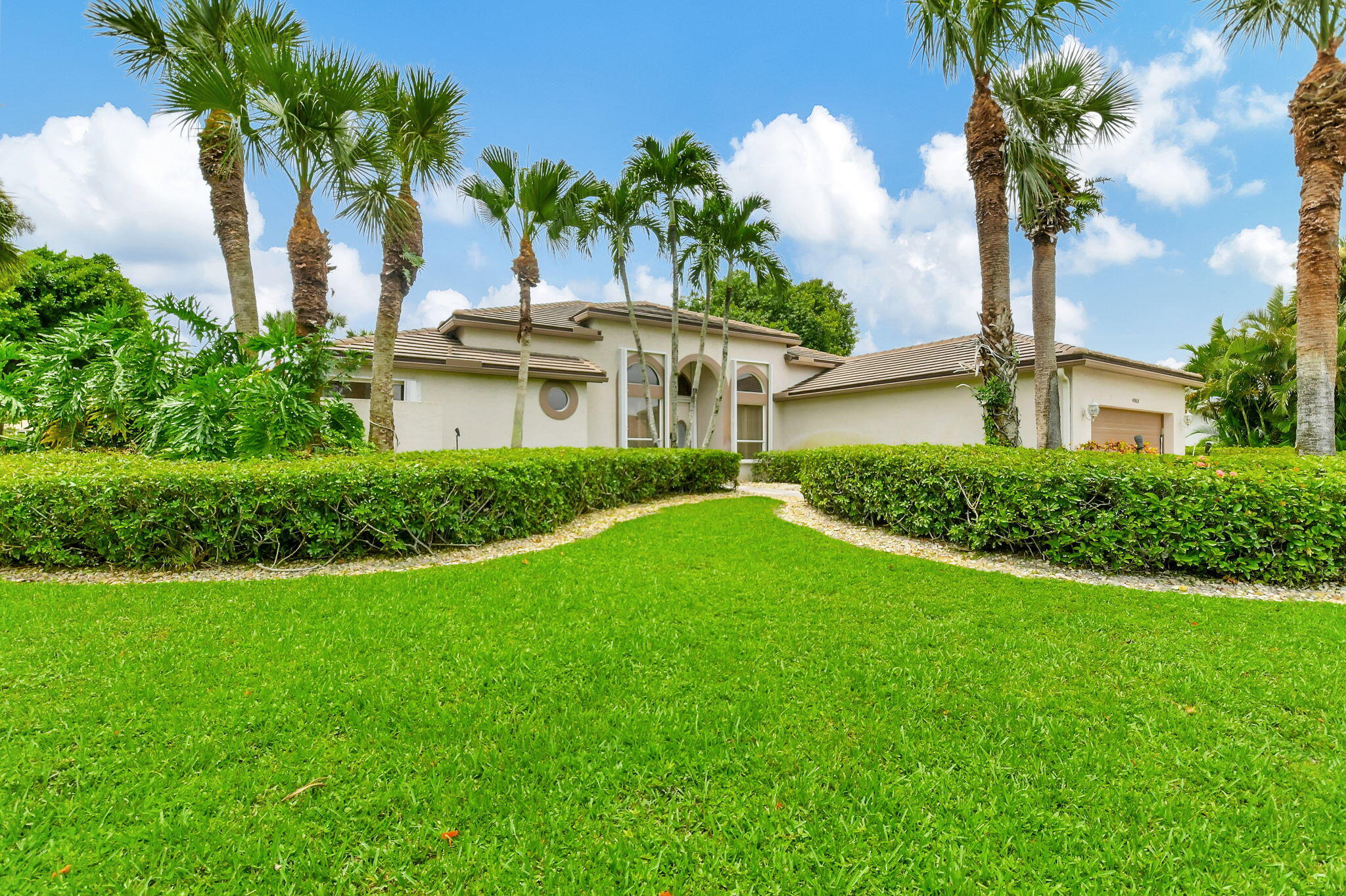 a front view of a house with garden