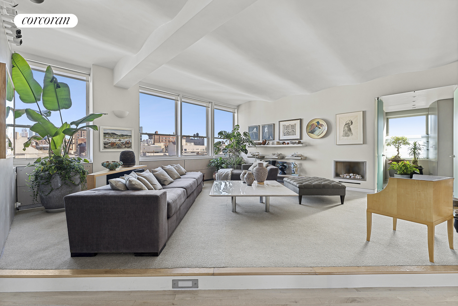 a living room with furniture and a fireplace