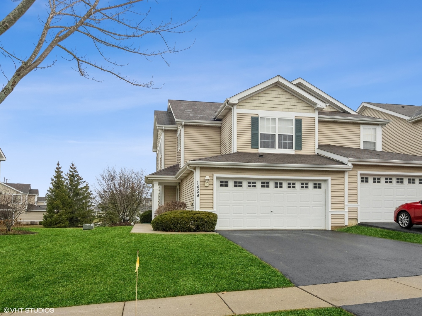 a front view of a house with a yard