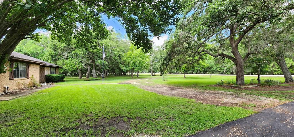 a view of a house with a big yard