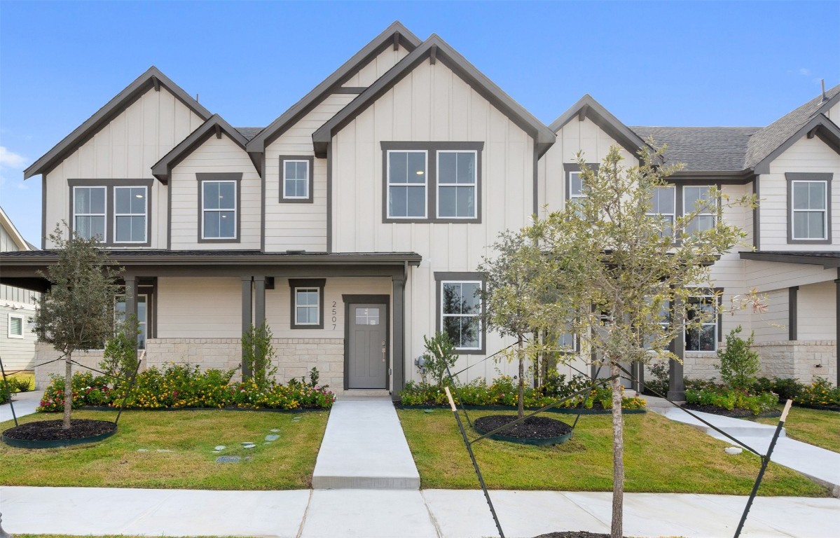 a front view of a house with a yard