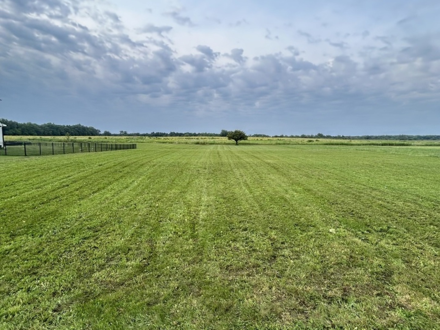 a view of a field with clear sky