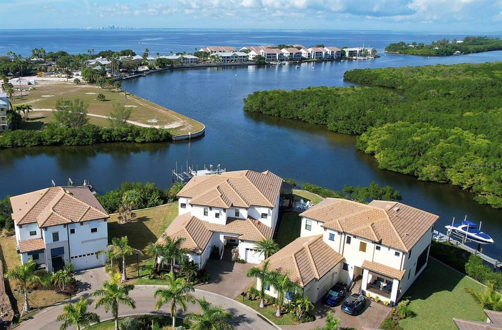 an aerial view of a house with outdoor space and lake view