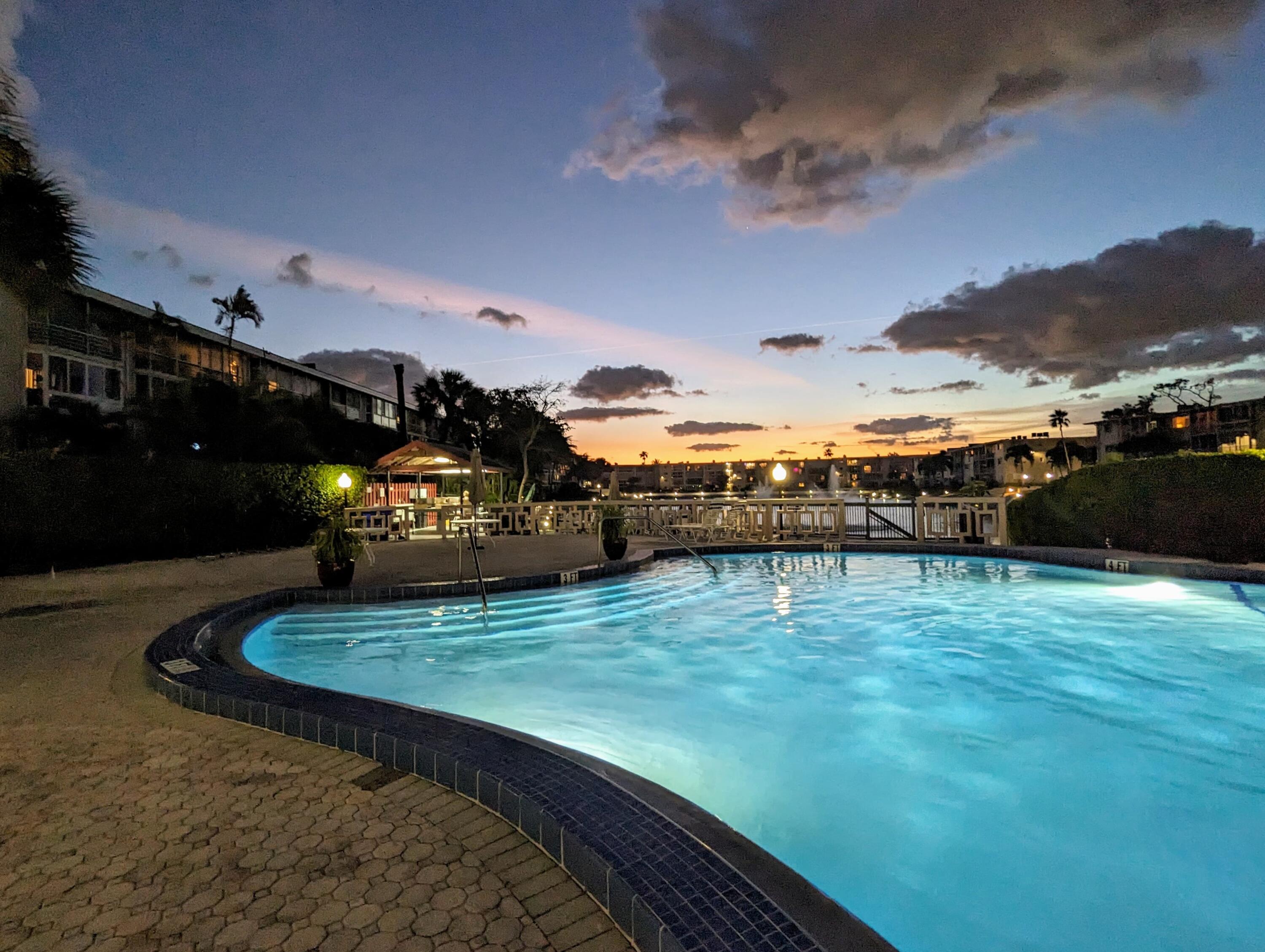 a view of a swimming pool with an ocean view