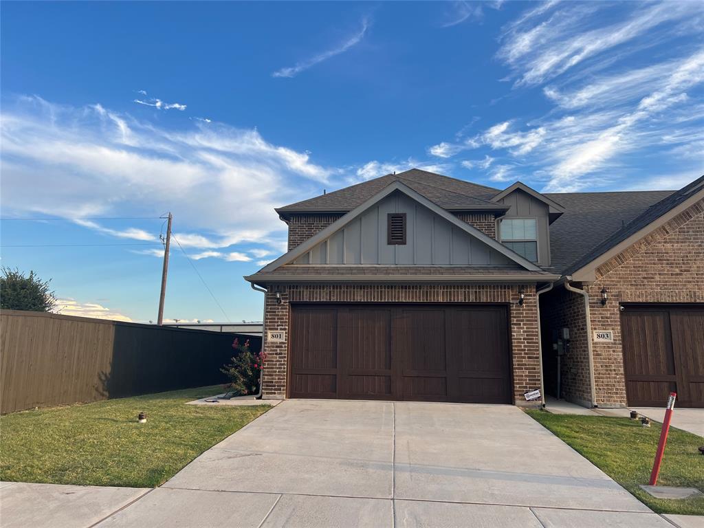 a front view of a house with yard