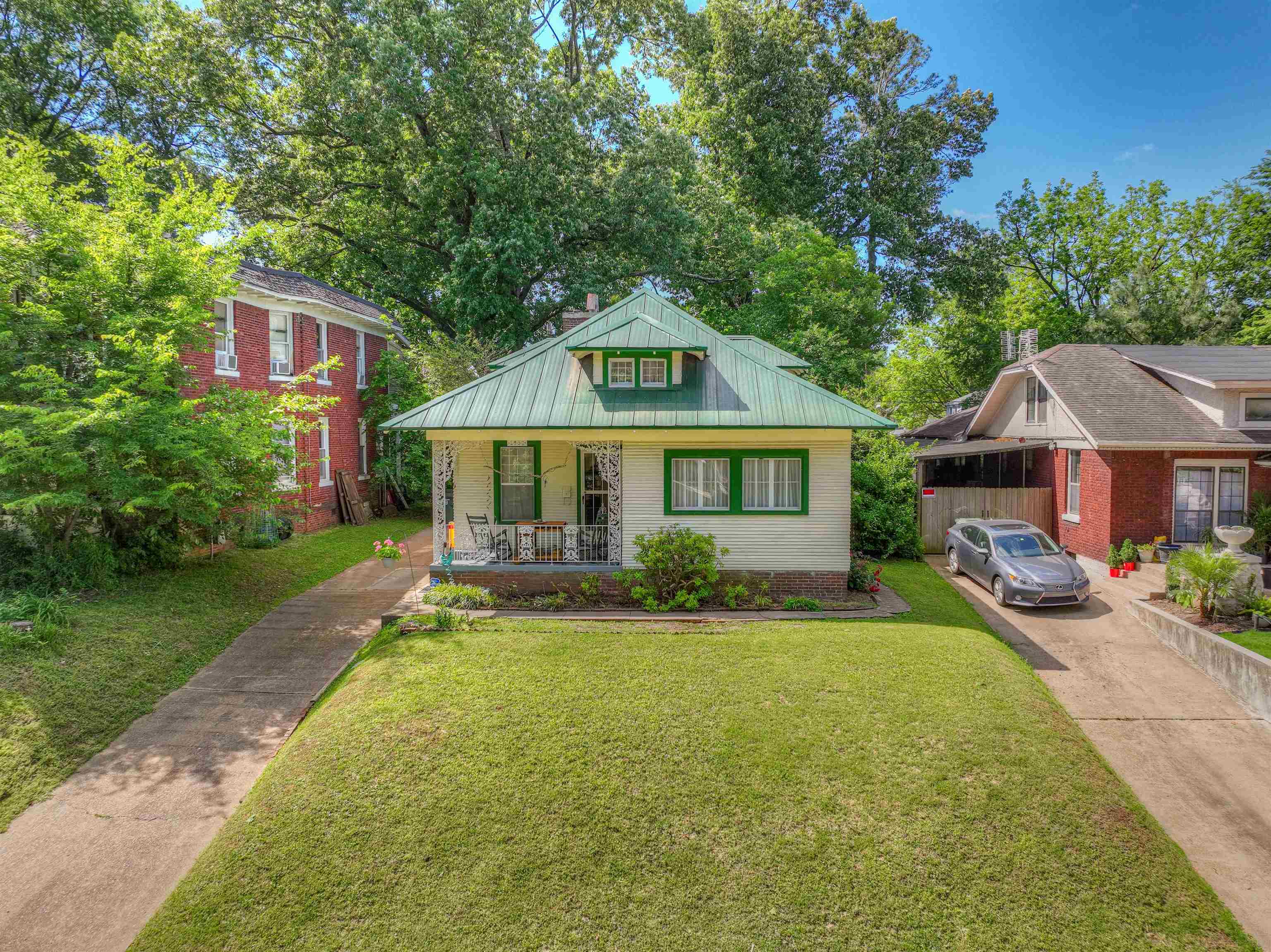 a front view of a house with a yard