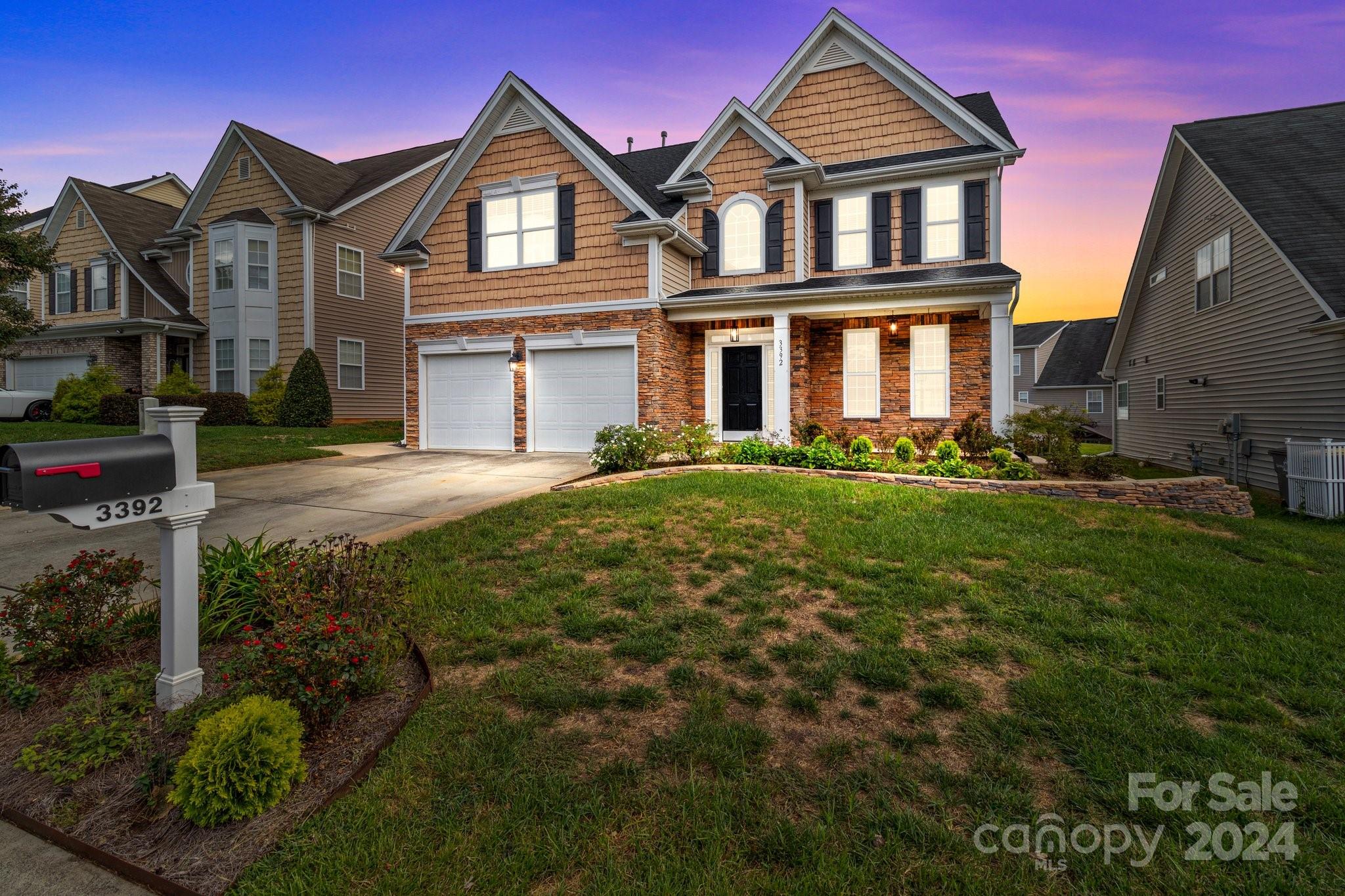 a front view of a house with a yard