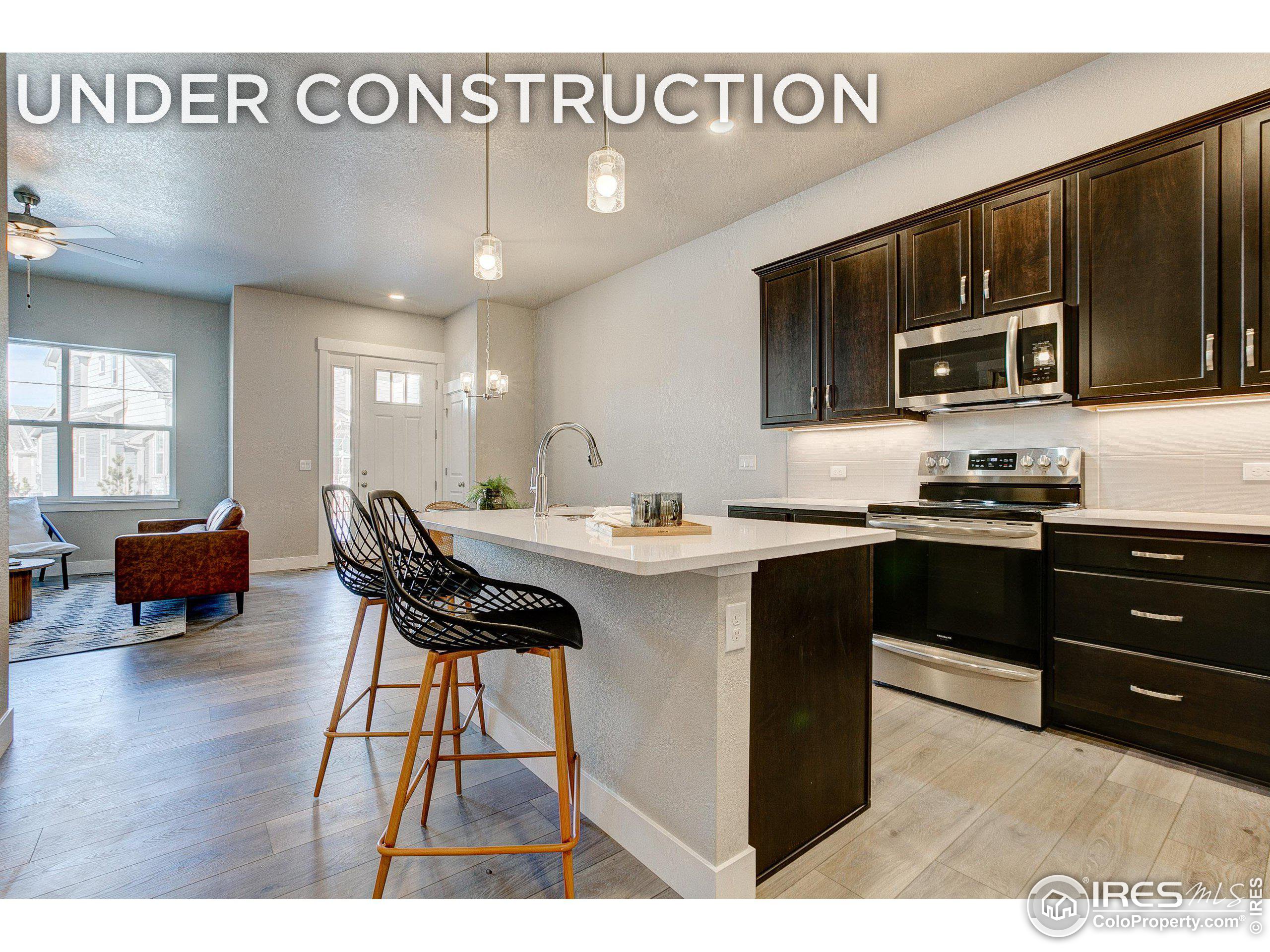 a kitchen with a sink cabinets and dining table