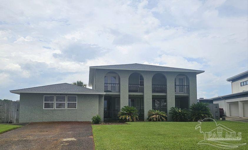 a view of a yard in front of a house