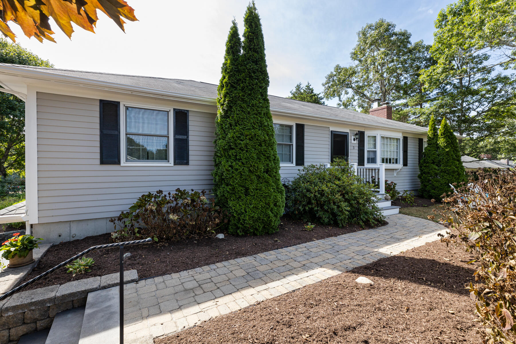 a front view of a house with garden