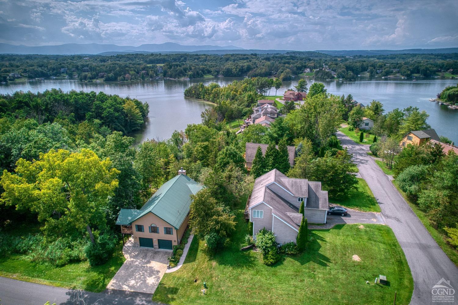 an aerial view of a house with a lake view