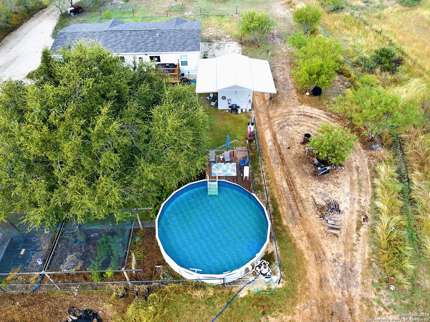 an aerial view of a house with swimming pool