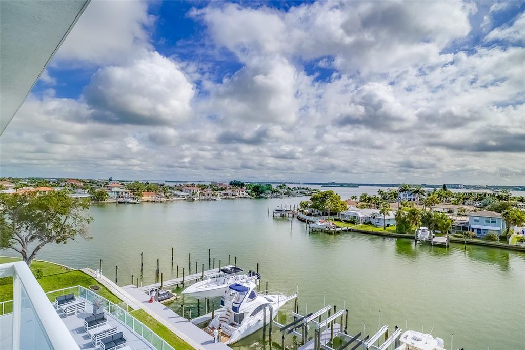 a view of a lake with houses in the back