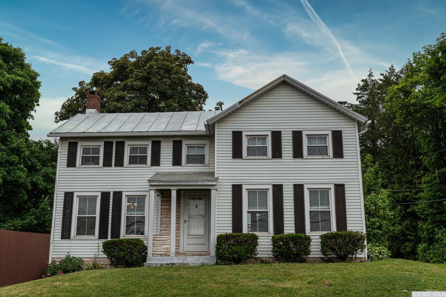 a front view of a house with a yard