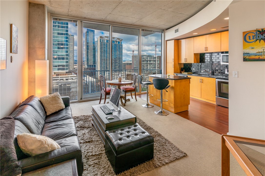 a living room with furniture and a large window