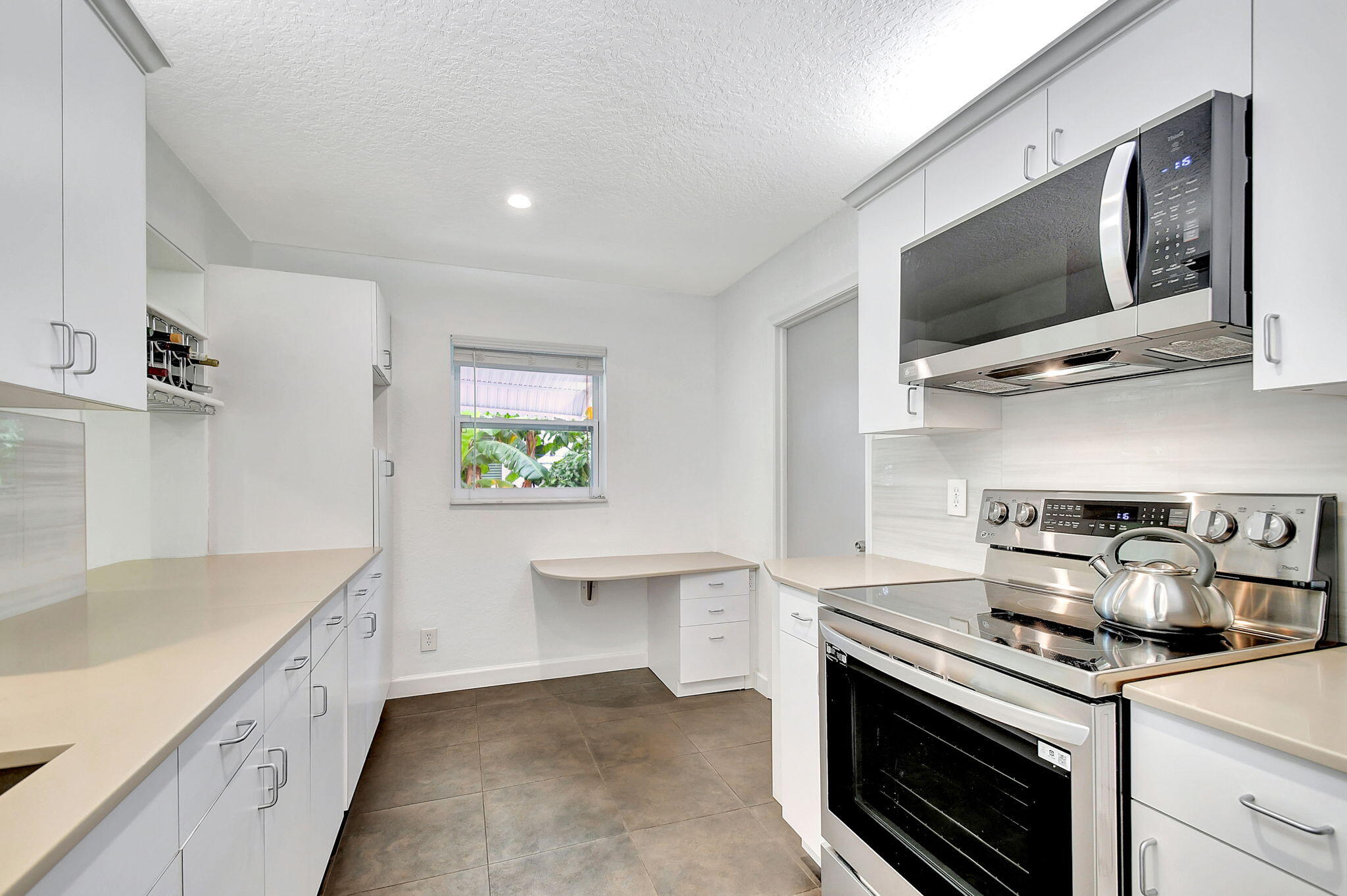 a kitchen with a stove and a microwave