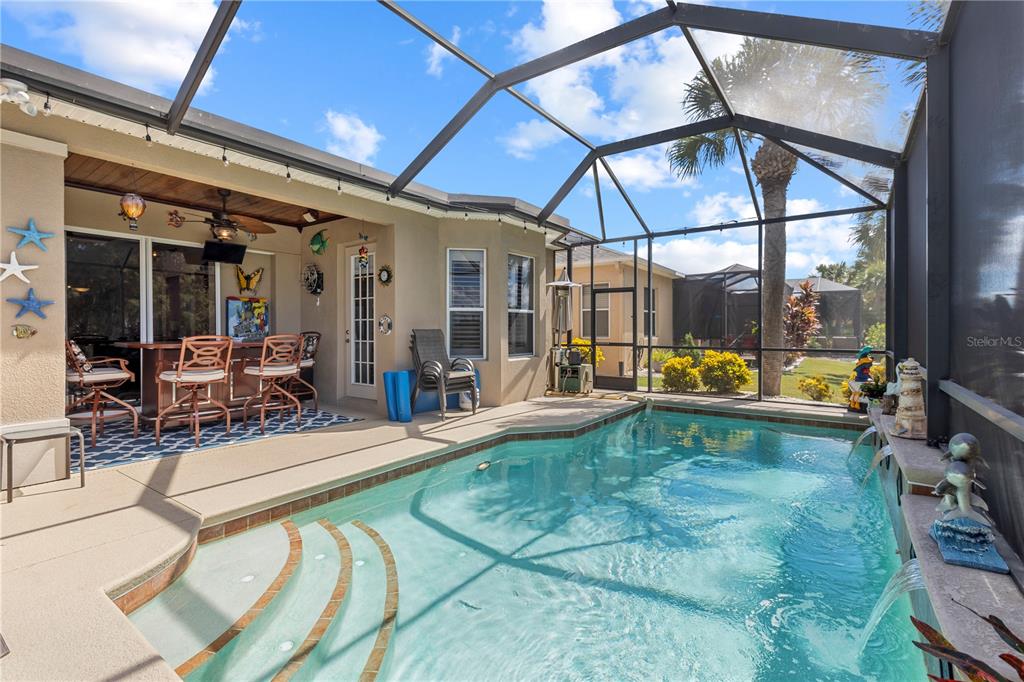 a view of a swimming pool with a patio