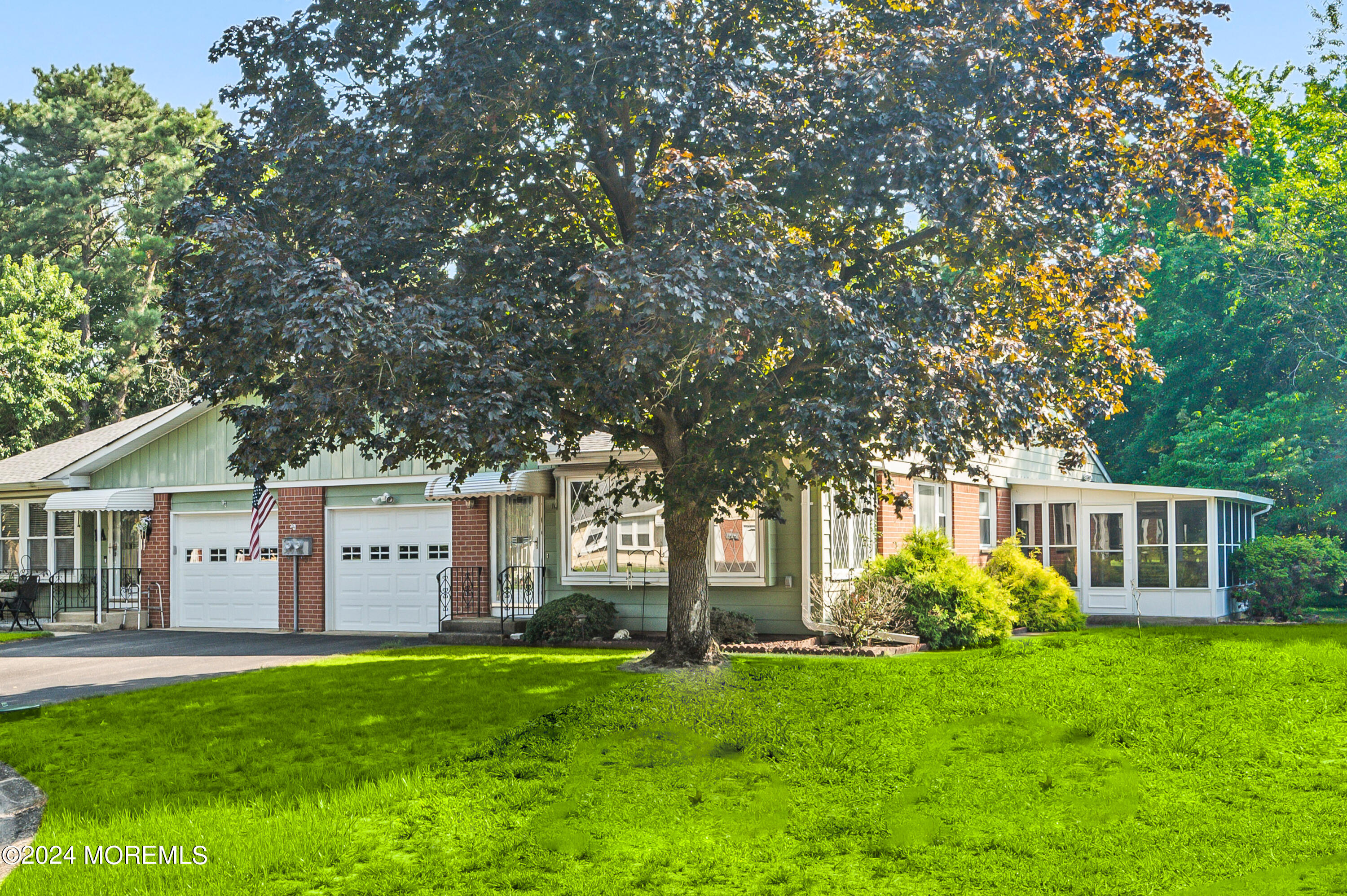 a view of a house with a backyard