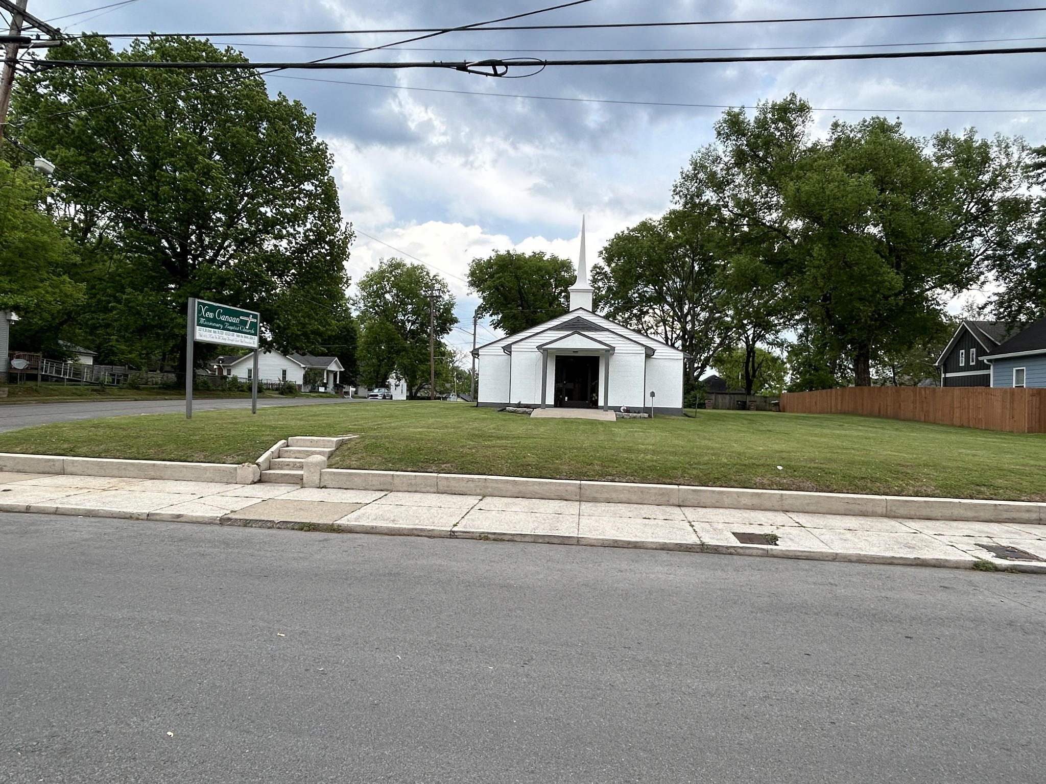 a view of a house with a yard and garage