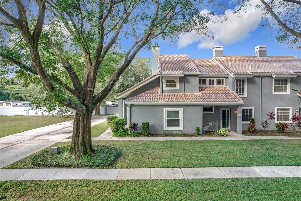 a front view of a house with a yard