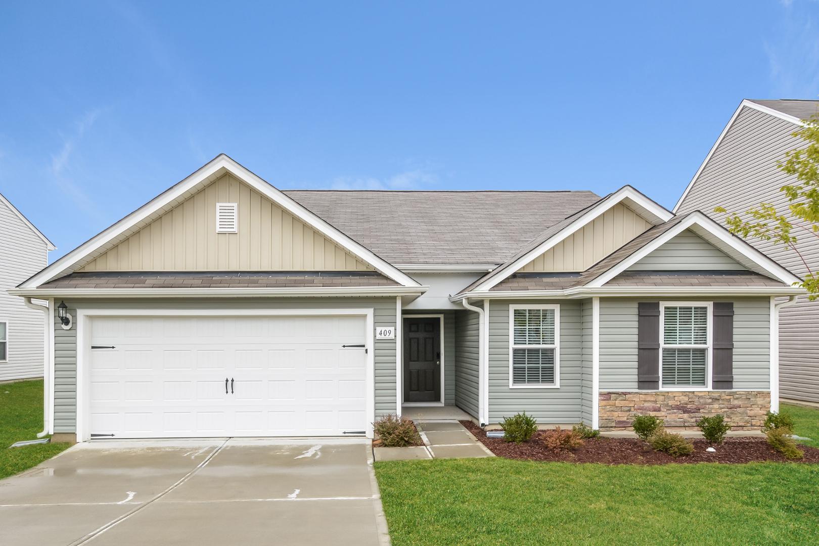 front view of a house with a yard