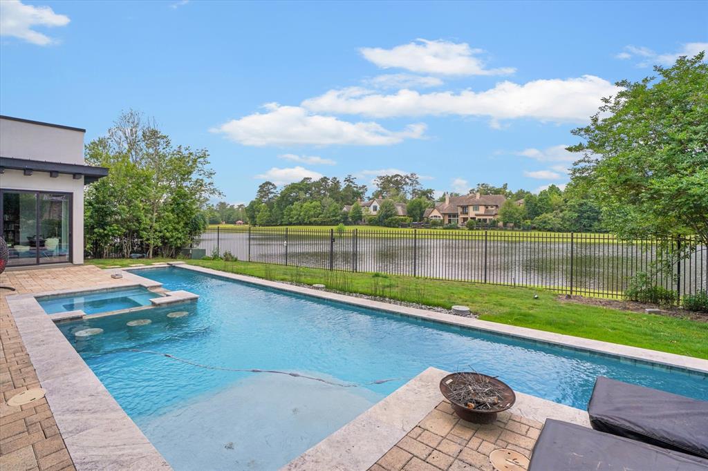 a view of swimming pool with a patio