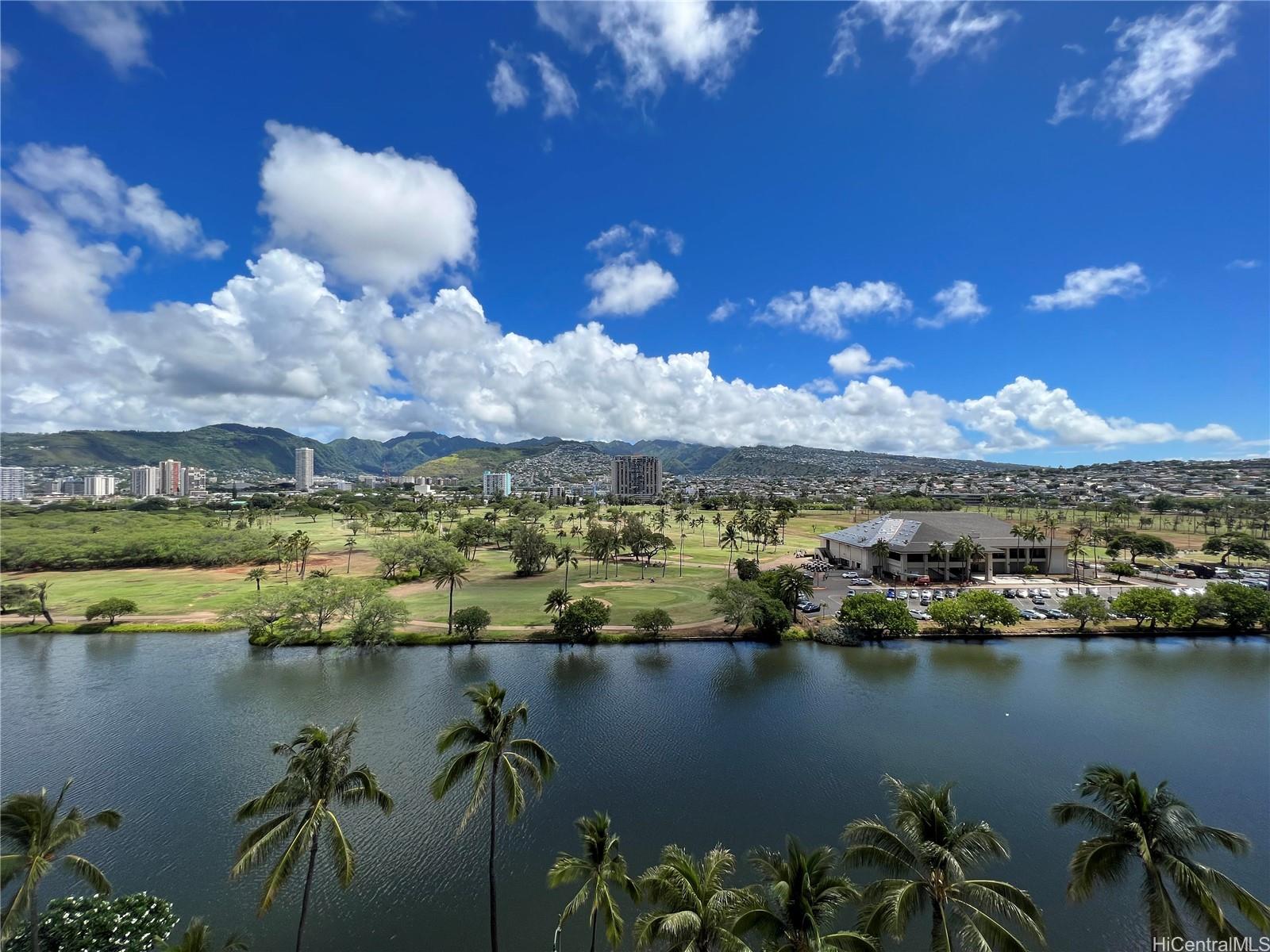 a view of a lake in middle of a city