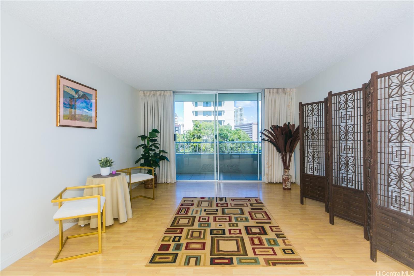 a bedroom with furniture and a rug