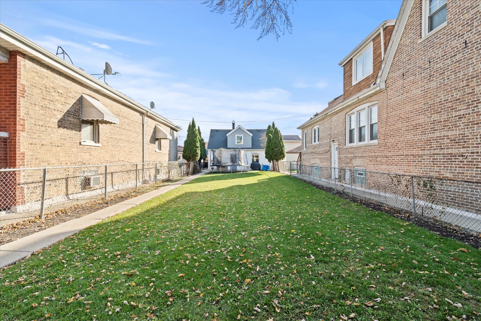 a view of backyard of a house