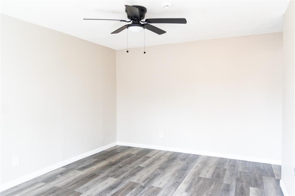 a view of a small space with wooden floor