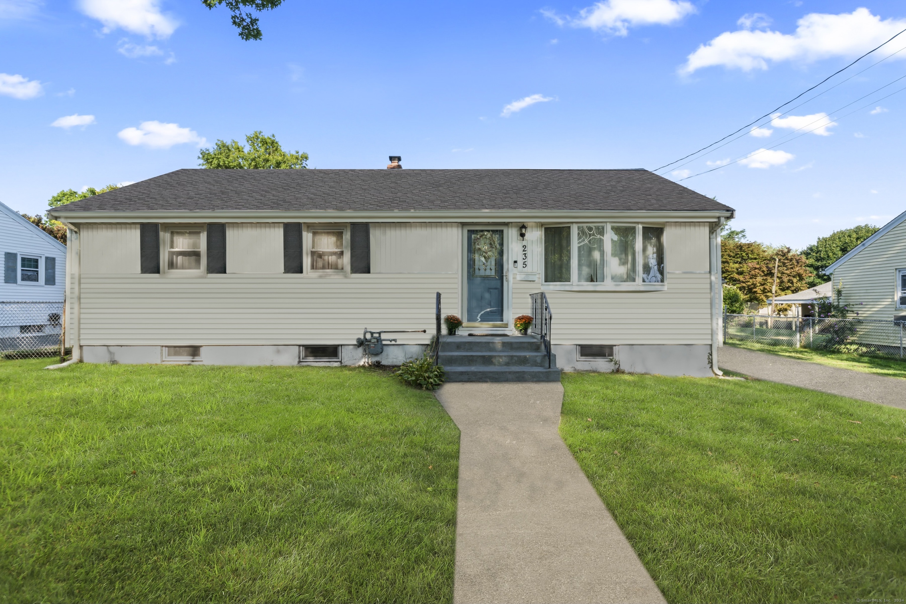 a front view of a house with yard