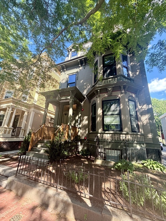 a view of a house with a tree