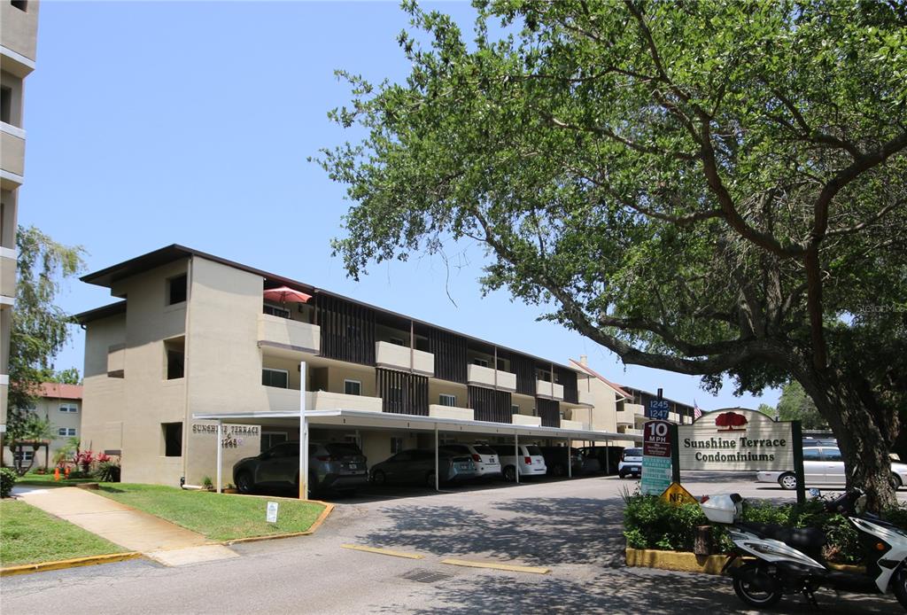 a front view of a building with garden