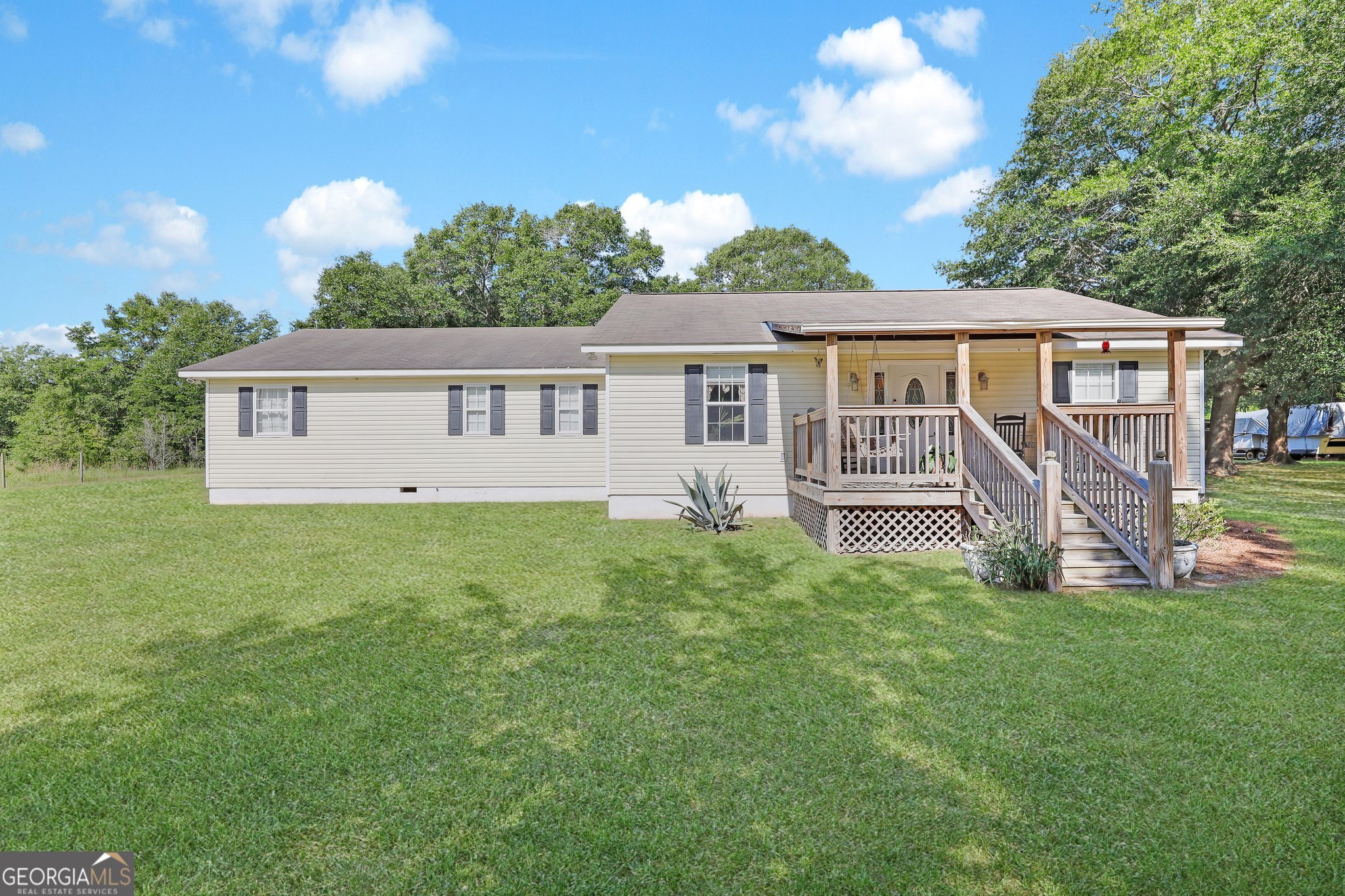 front view of a house with a yard