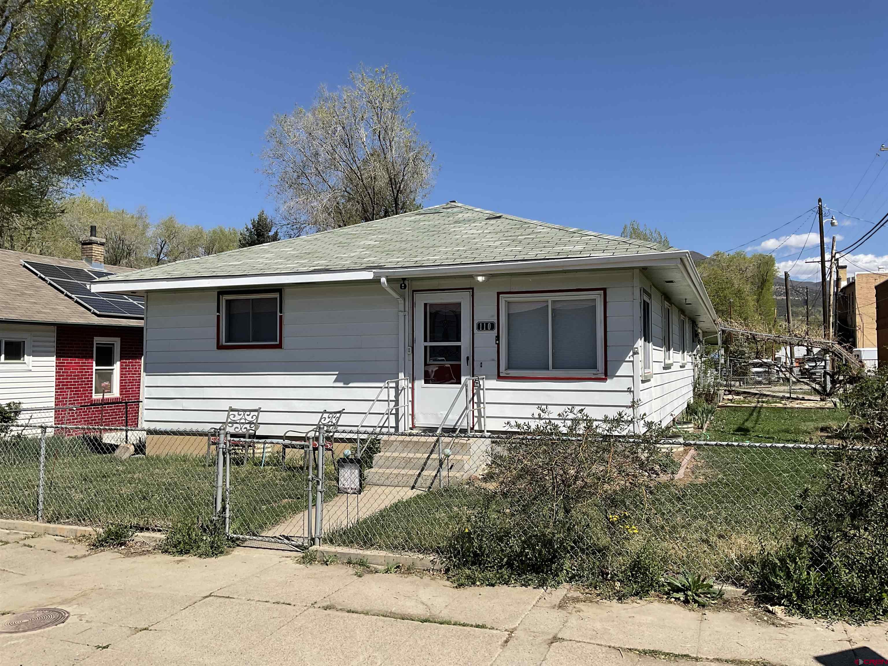 a view of a house with a yard