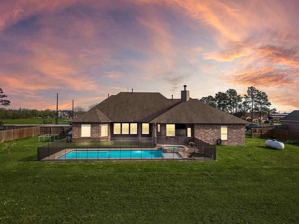 Spacious backyard with in-ground heated pool and spa!