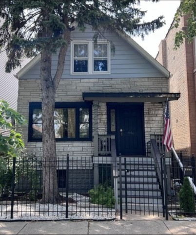 a front view of a house with a fence